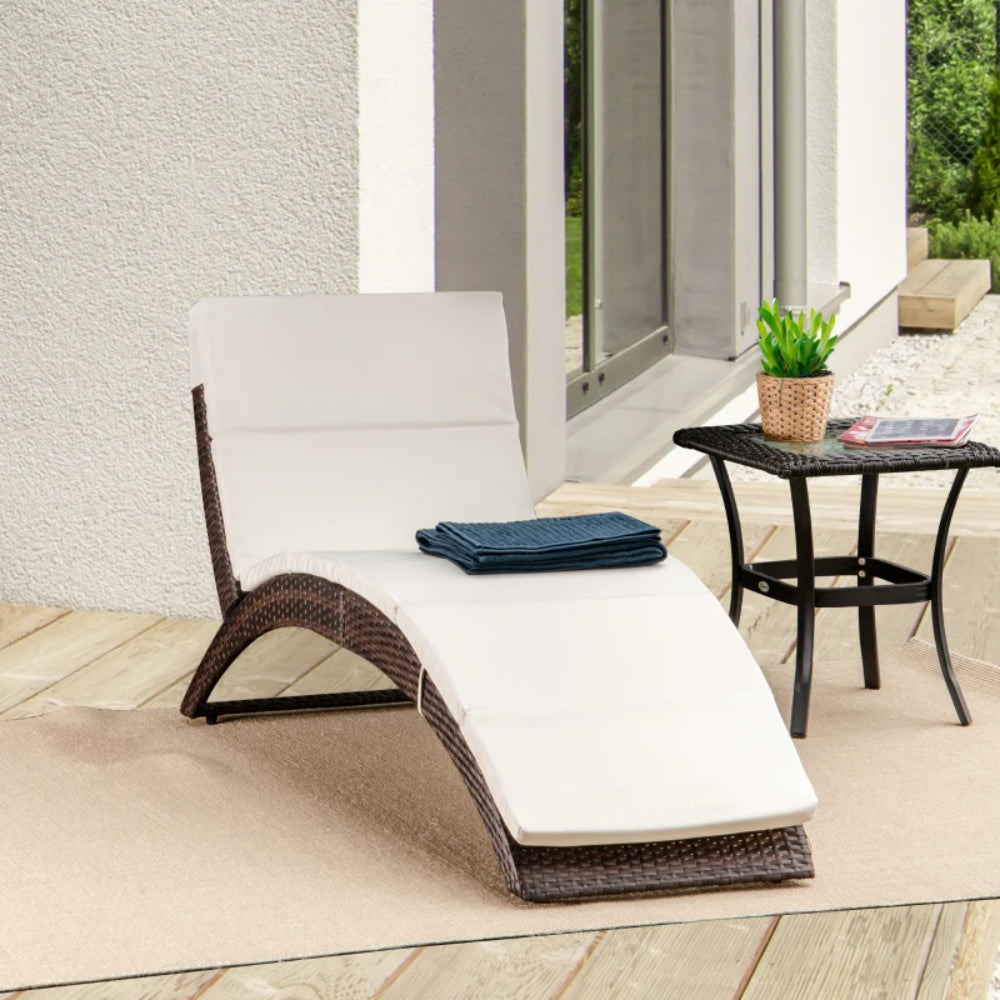 Outsunny Folding Sun Lounger, PE Rattan Garden Lounger Chair with Soft Padded Cushion, Ergonomic Curved Design Sun Bed for Balcony, Garden, Brown