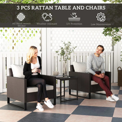 Outsunny 3 Pieces Rattan Bistro Set with 4 Cushions, Wicker Garden Furniture Set, Glass Top Coffee Table and Chairs for Outdoor Patio, Balcony, Terrace and Conservatory